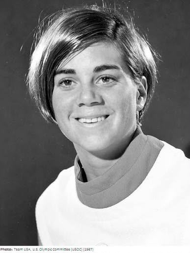 Black-and-white studio portrait of Pokey Watson in 1967, smiling, with short hair and a white top